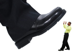 Businessman's Foot Stepping Stomping Out the Competition