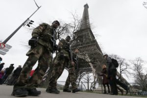 French soldiers patrol near the Eiffel Tower in Paris as part of the "Vigipirate" security plan