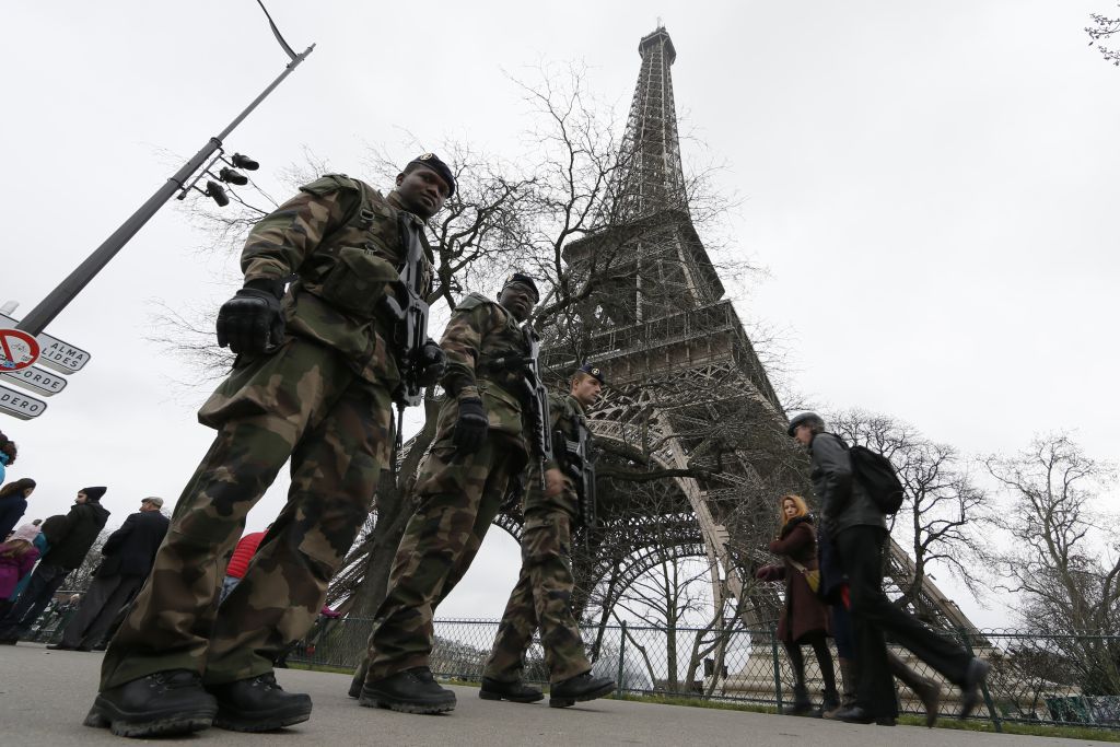 French soldiers patrol near the Eiffel Tower in Paris as part of the "Vigipirate" security plan
